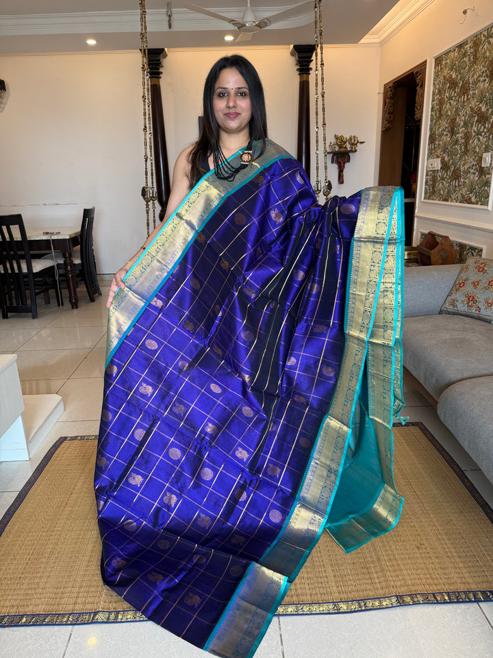 Dark Blue with Light Blue  , Zari Kattam in the body with mayil and Chakram butta , traditional borders and rich Pallu , silk cotton saree