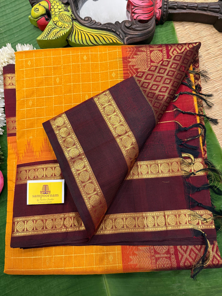 Manjal with Dark Maroon , traditional rettapet border , Zari kattam in the body with Zari butta , rich Pallu  Korvai Silk Cotton Saree