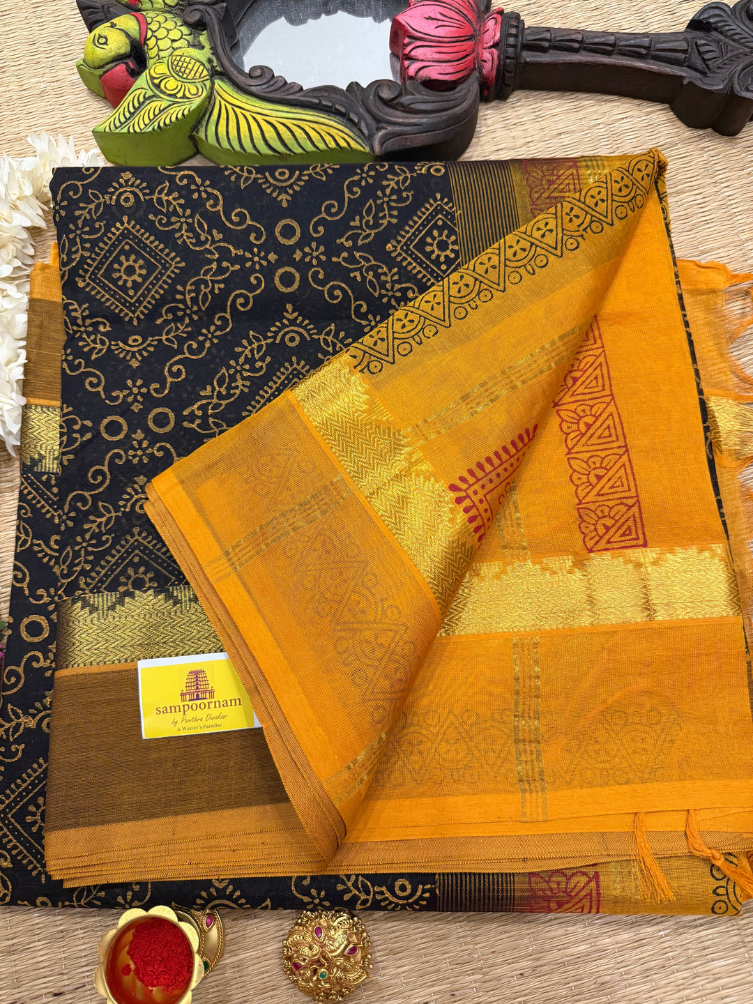 Black with Mustard Rangoli Deisgns all over the body, Silk Cotton Saree