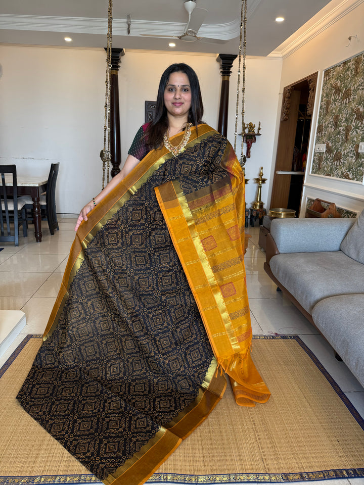 Black with Mustard Rangoli Deisgns all over the body, Silk Cotton Saree