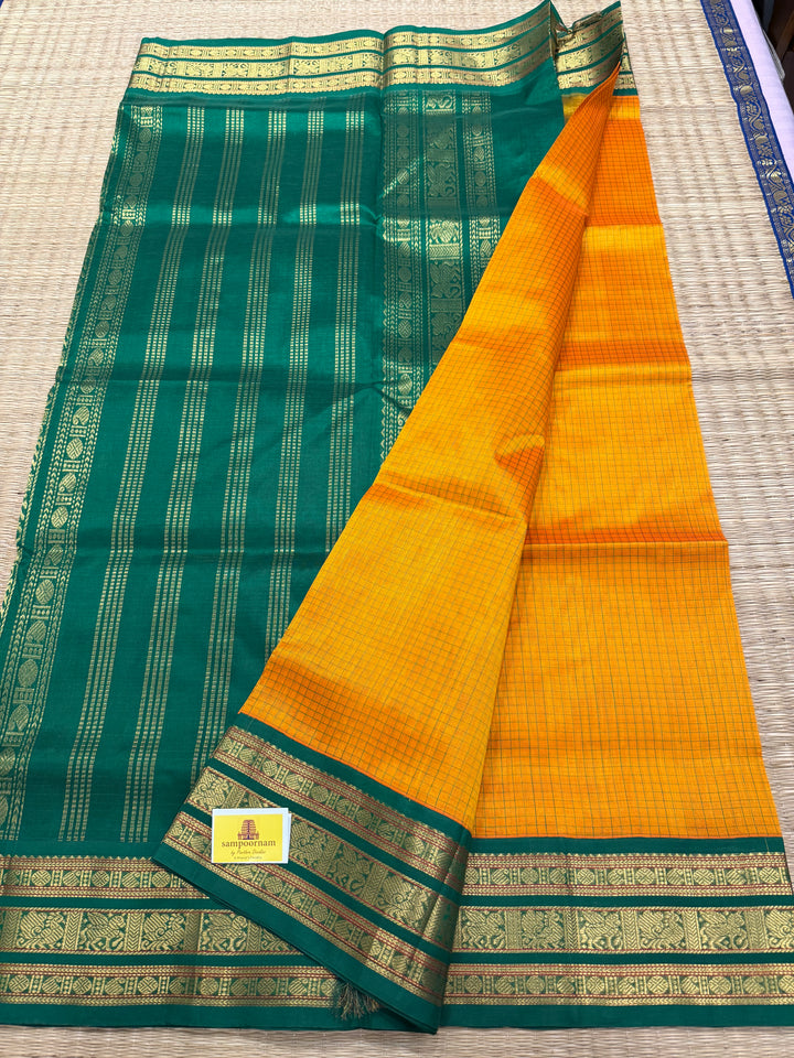 Mambazha Manjal with Green Podi Kattam  , traditional kanchi borders and rich Pallu Korvai Silk Cotton Saree