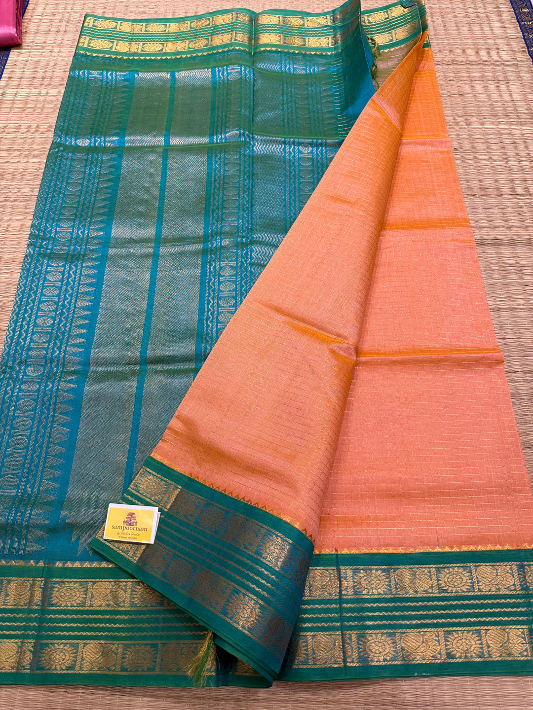 Peach Pink with Sea Green , rich Zari checks in the body ,rettapet border and grand Pallu Korvai Silk Cotton Saree