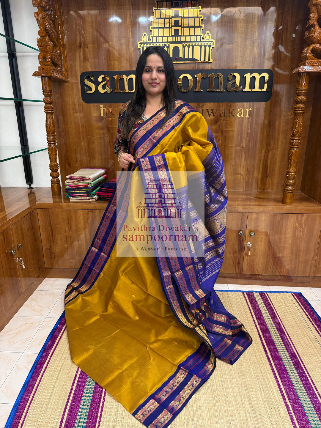 Dark Gold with Dark Blue , Zari butta in the body , rettapet borders and Zari checks in the body , rich Pallu Korvai Silk Cotton Saree