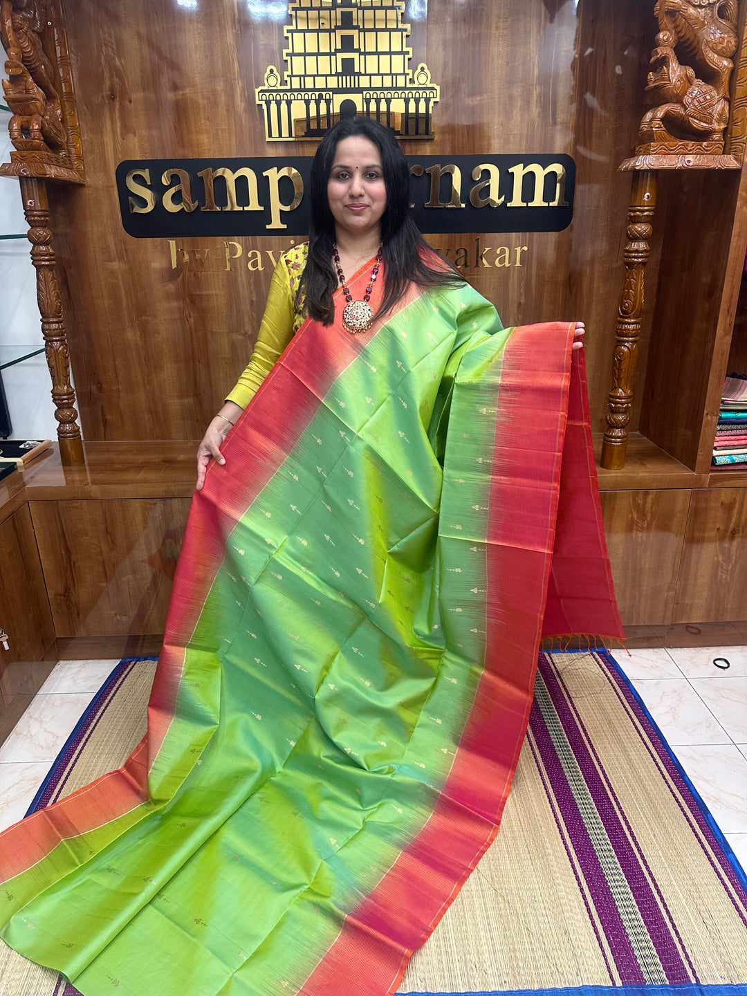 Double Shaded Green with Orangish Pink , Rich Zari Butta in the body and grand Pallu , Pure Soft Silk Saree