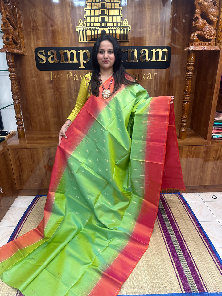 Double Shaded Green with Orangish Pink , Rich Zari Butta in the body and grand Pallu , Pure Soft Silk Saree