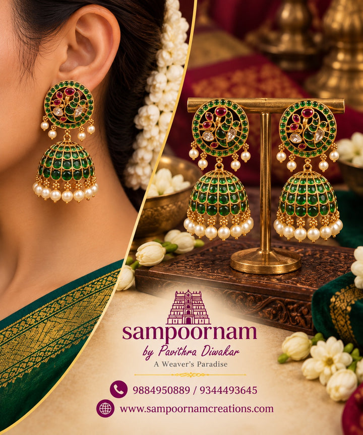 A  Gorgeous Peacock - inspired Jhumka Featuring intricate Floral detailing , rich Ruby toned stones and Subtle Green accents. Finished with delicate Pearl drops for an Elegant , Traditional touch