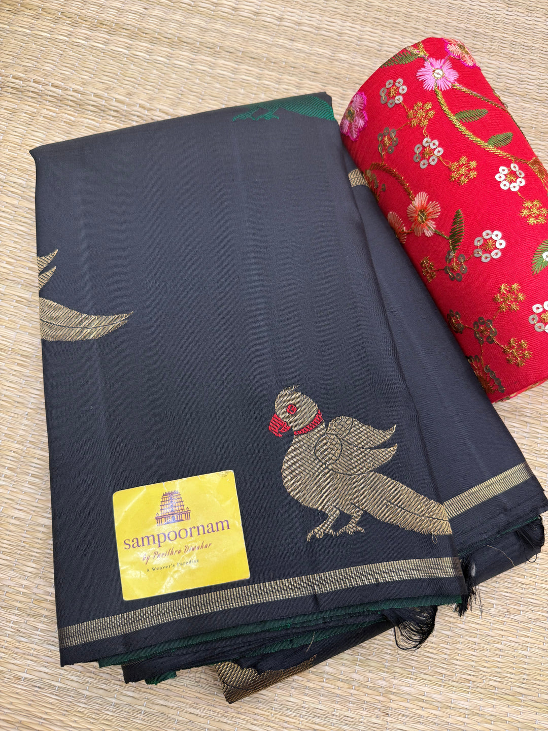 A classic Borderless Black saree, with Thread and Zari Killi Butta in the body and Pallu , Pure Zari Pure Kanjivaram Silk Saree