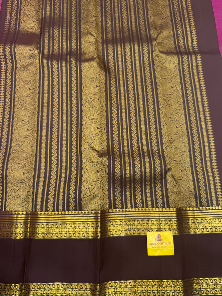 A Vintage Classic Jamun Colour Saree with Dark Brown, Traditional Mayil and Chakram Butta in the Body and Rich Zari Pallu , Pure Kanjivaram Silk Saree