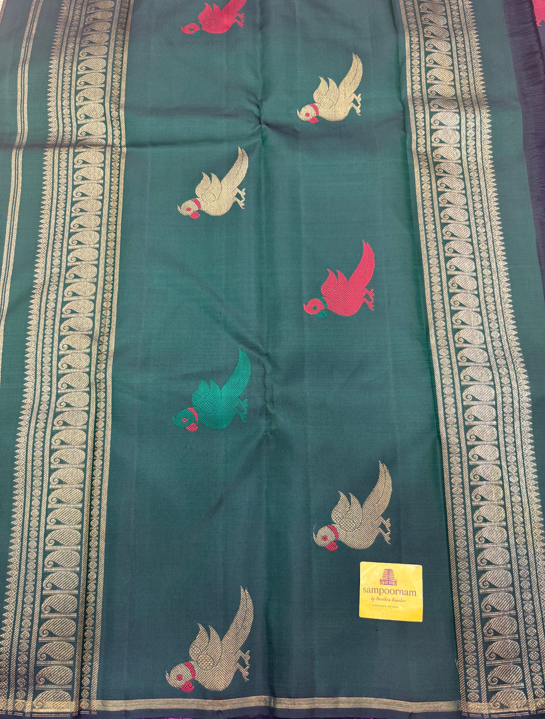 A classic Borderless Black saree, with Thread and Zari Killi Butta in the body and Pallu , Pure Zari Pure Kanjivaram Silk Saree