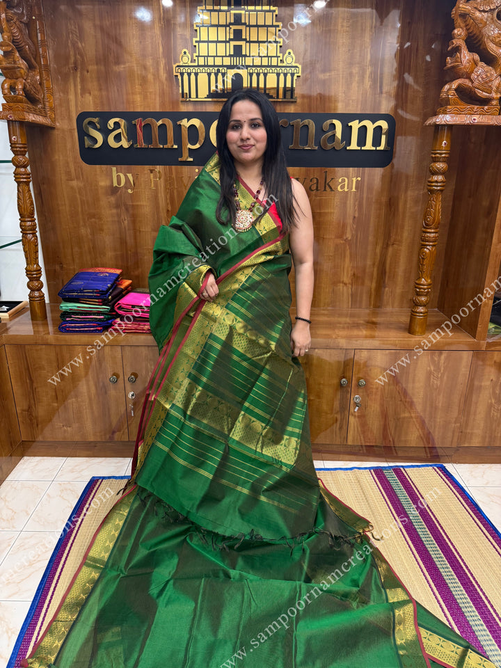 Green , Red Selvedge , Vairaoosi Zari Lines in the body , traditional borders and rich Pallu ,Ten Yards Silk Cotton Saree