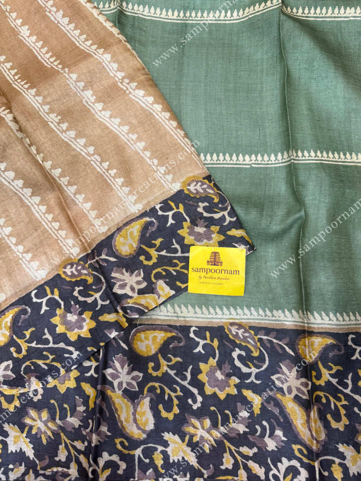 Green with Black , Handblock  Print in the body  with heavy  Paisley designs in the borders and Pallu  ,  Pure Tussar Silk Saree