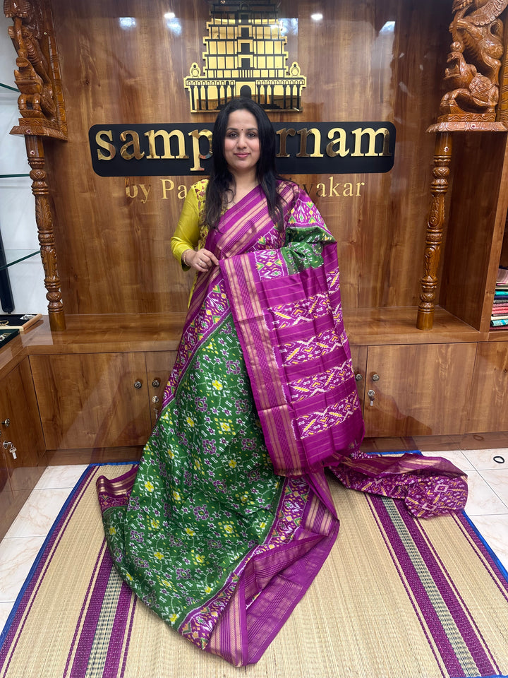 A stunning Green with Magenta saree , Pochampally design in the body and Pallu , Pure Pochampally Silk Saree
