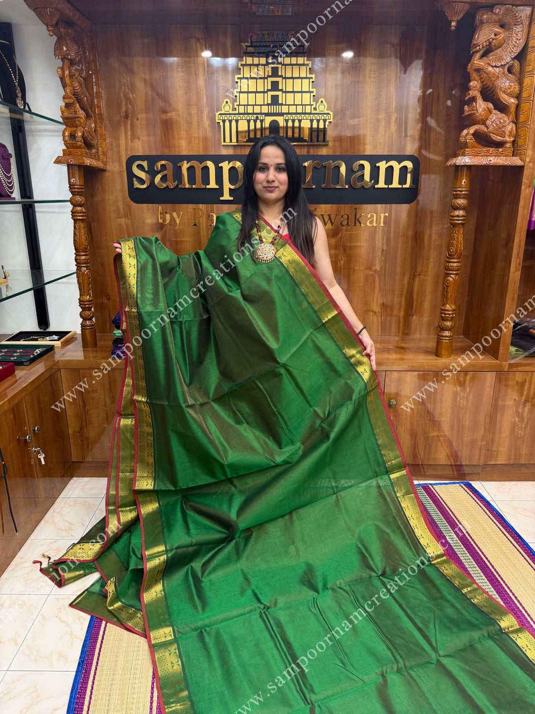 Green , Red Selvedge , Vairaoosi Zari Lines in the body , traditional borders and rich Pallu ,Ten Yards Silk Cotton Saree