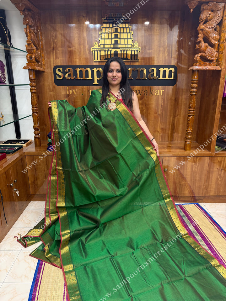 Green , Red Selvedge , Vairaoosi Zari Lines in the body , traditional borders and rich Pallu ,Ten Yards Silk Cotton Saree