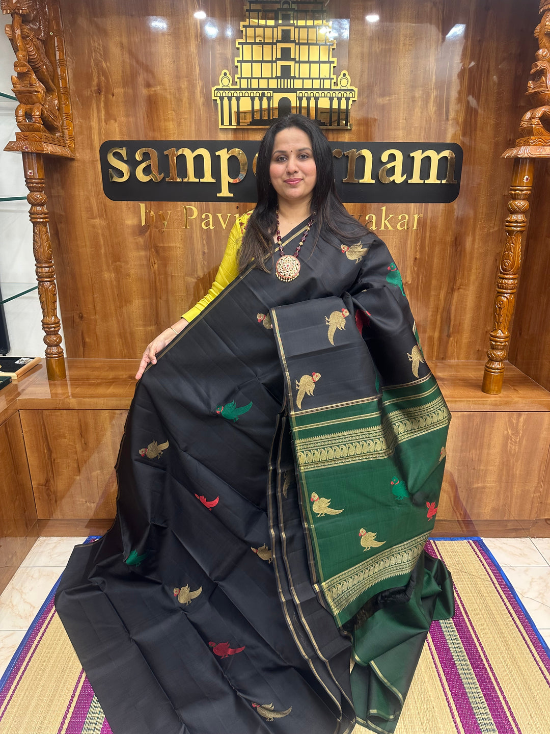 A classic Borderless Black saree, with Thread and Zari Killi Butta in the body and Pallu , Pure Zari Pure Kanjivaram Silk Saree