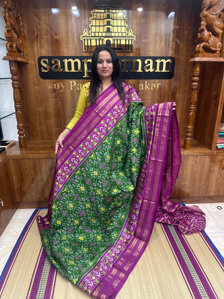 A stunning Green with Magenta saree , Pochampally design in the body and Pallu , Pure Pochampally Silk Saree