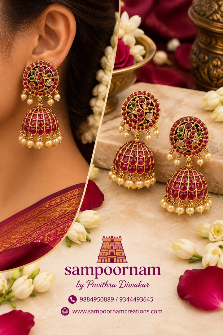 A Gorgeous Peacock - inspired Jhumka Featuring intricate Floral detailing , rich Ruby toned stones and Subtle Green accents. Finished with delicate Pearl drops for an Elegant , Traditional touch