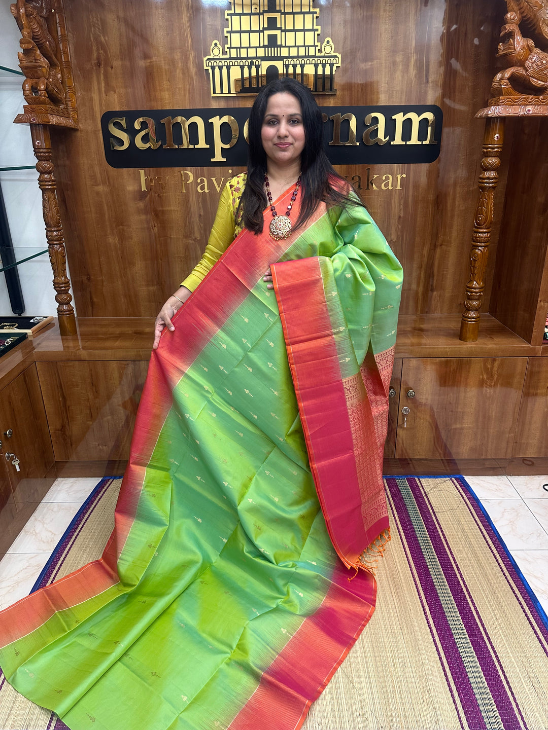 Double Shaded Green with Orangish Pink , Rich Zari Butta in the body and grand Pallu , Pure Soft Silk Saree