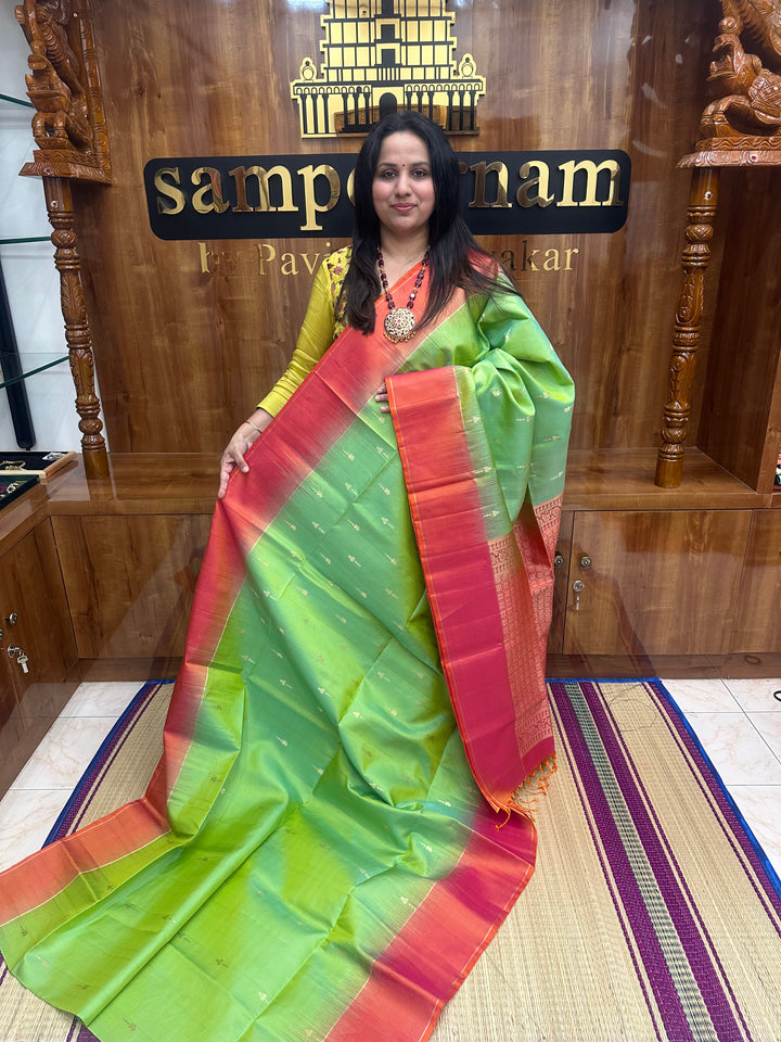 Double Shaded Green with Orangish Pink , Rich Zari Butta in the body and grand Pallu , Pure Soft Silk Saree
