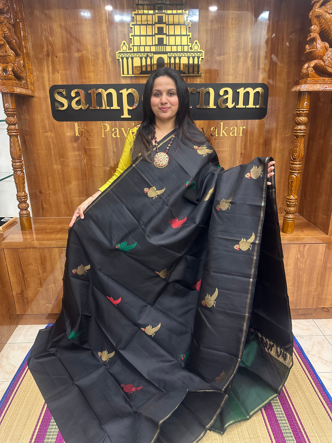 A classic Borderless Black saree, with Thread and Zari Killi Butta in the body and Pallu , Pure Zari Pure Kanjivaram Silk Saree