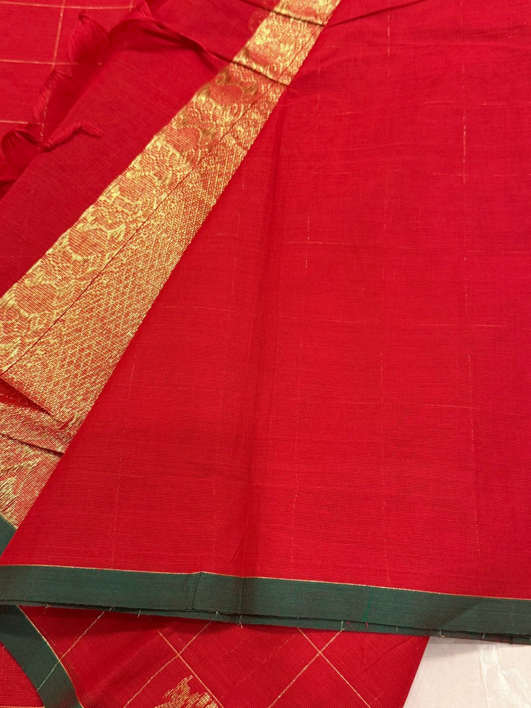 A beautiful red with green Selvedge, Zari Mayil butta and grand Kanchi pallu , Chettinad cotton saree