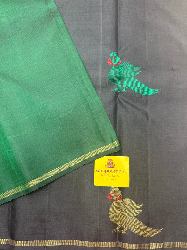 A classic Borderless Black saree, with Thread and Zari Killi Butta in the body and Pallu , Pure Zari Pure Kanjivaram Silk Saree