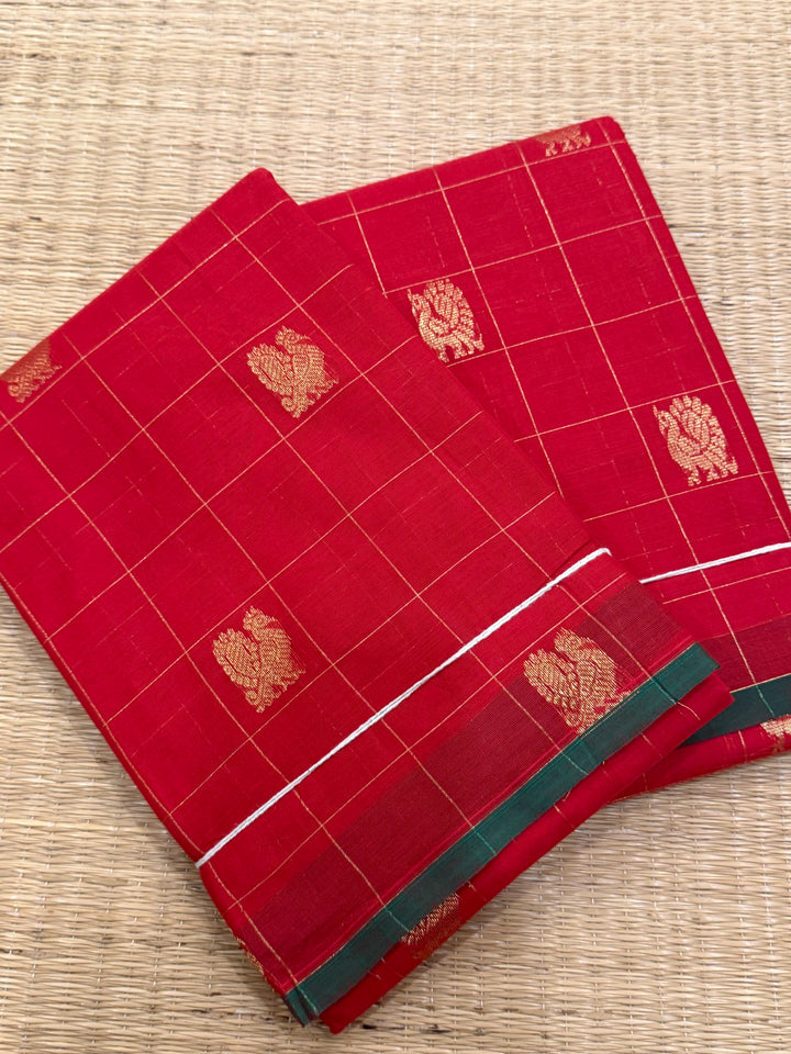 A beautiful red with green Selvedge, Zari Mayil butta and grand Kanchi pallu , Chettinad cotton saree