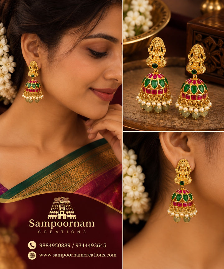A Stunning Lakshmi motif Jhumka Adorned with Rich Green and Pink stones , delicate Pearl accents and Cascading Green bead Hangings .