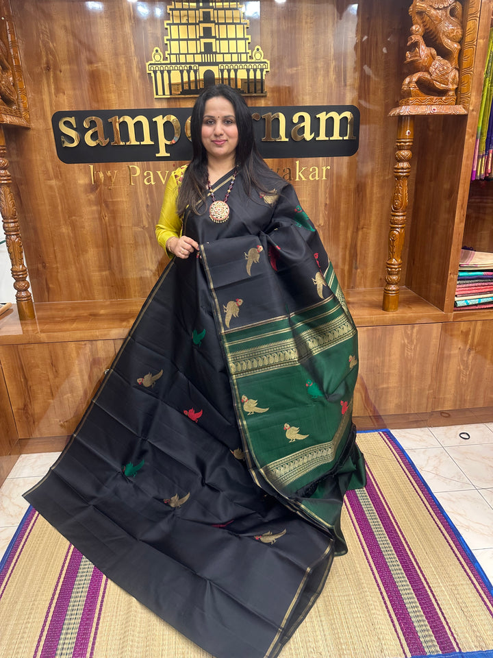 A classic Borderless Black saree, with Thread and Zari Killi Butta in the body and Pallu , Pure Zari Pure Kanjivaram Silk Saree