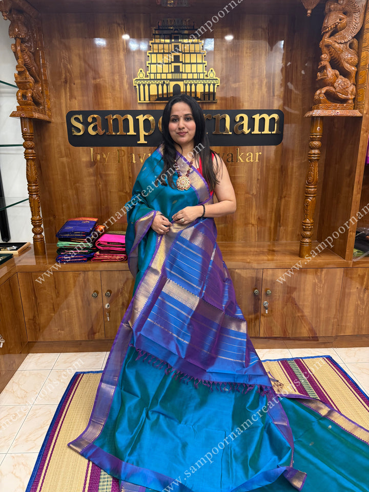 Blue with Mayilkazhuthu Blue  , Zari butta in the body ,   traditional borders and grand Pallu , Ten Yards Silk Cotton Saree