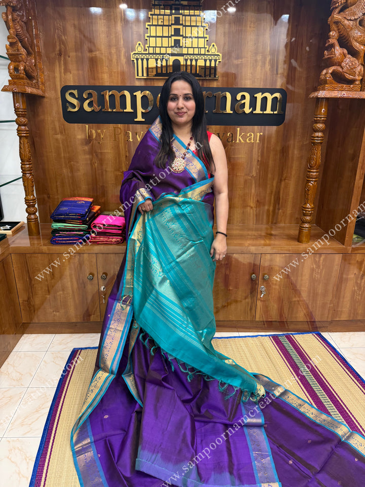 Purple with Turquoise Blue , Zari butta in the body with Vairaoosi Zari Lines , traditional borders and rich Pallu ,Ten Yards Silk Cotton Saree