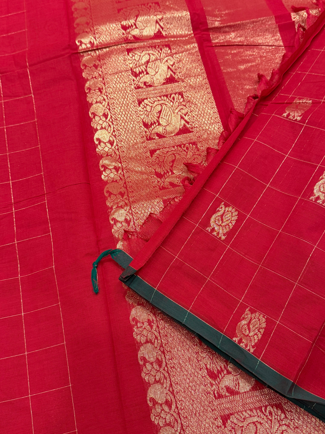 A beautiful red with green Selvedge, Zari Mayil butta and grand Kanchi pallu , Chettinad cotton saree