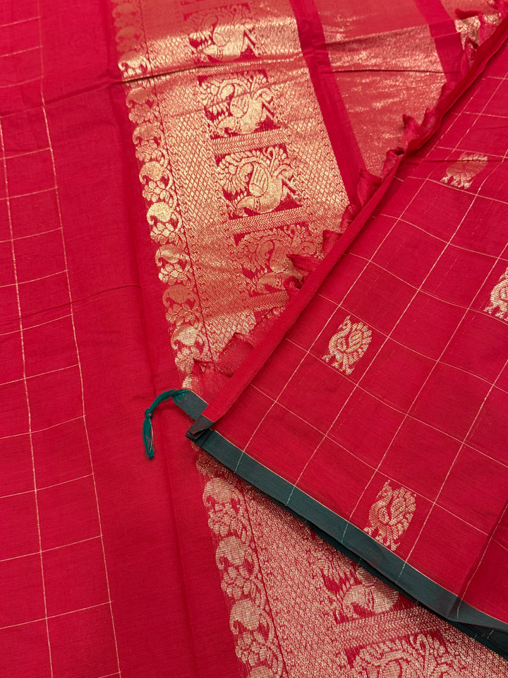 A beautiful red with green Selvedge, Zari Mayil butta and grand Kanchi pallu , Chettinad cotton saree