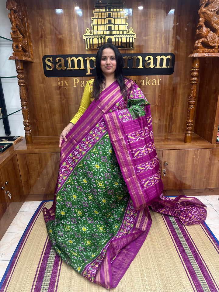 A stunning Green with Magenta saree , Pochampally design in the body and Pallu , Pure Pochampally Silk Saree