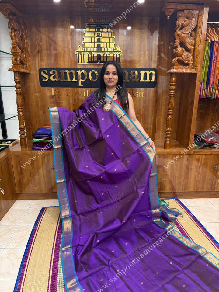 Purple with Turquoise Blue , Zari butta in the body with Vairaoosi Zari Lines , traditional borders and rich Pallu ,Ten Yards Silk Cotton Saree