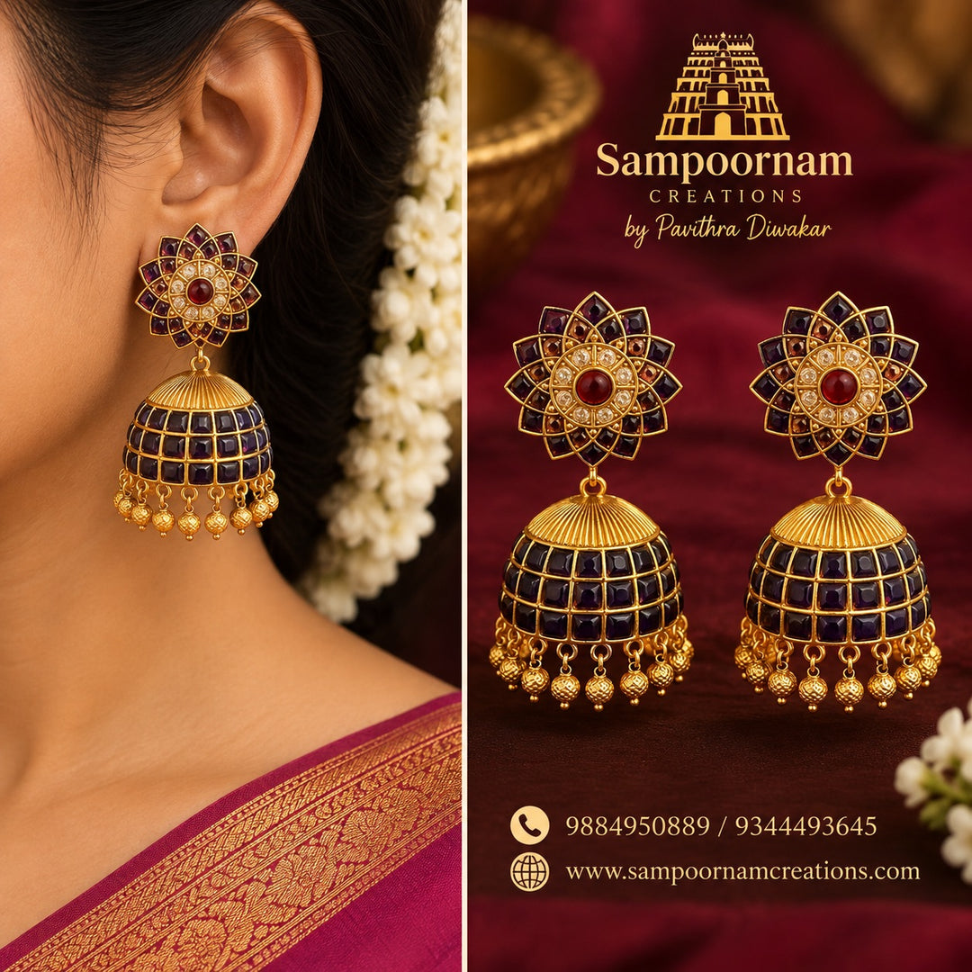 A Striking Floral - inspired Jhumka featuring Rich Blue Stones , accented with Sparkling White and Red Stones and intricate Gold - toned detailing . Finished with beautiful Gold Ball Hangings