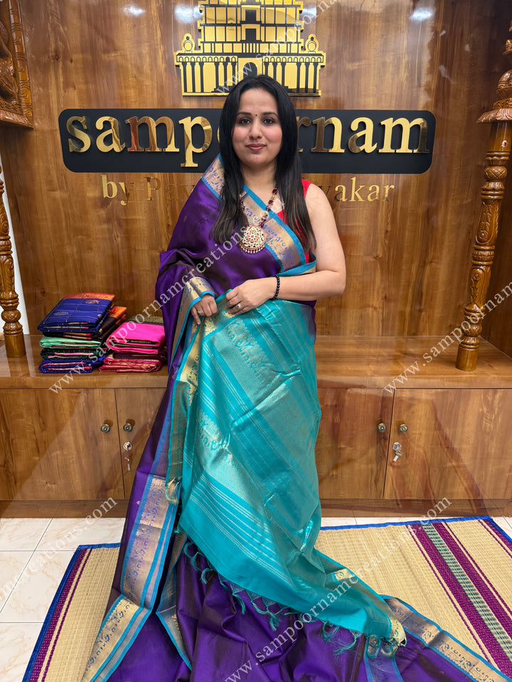Purple with Turquoise Blue , Zari butta in the body with Vairaoosi Zari Lines , traditional borders and rich Pallu ,Ten Yards Silk Cotton Saree