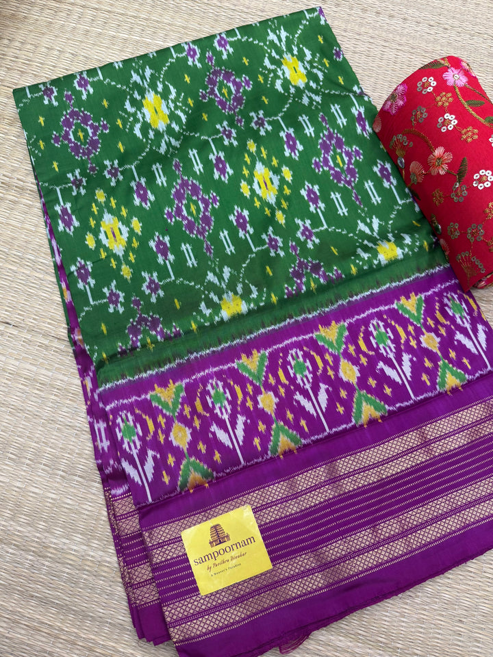 A stunning Green with Magenta saree , Pochampally design in the body and Pallu , Pure Pochampally Silk Saree