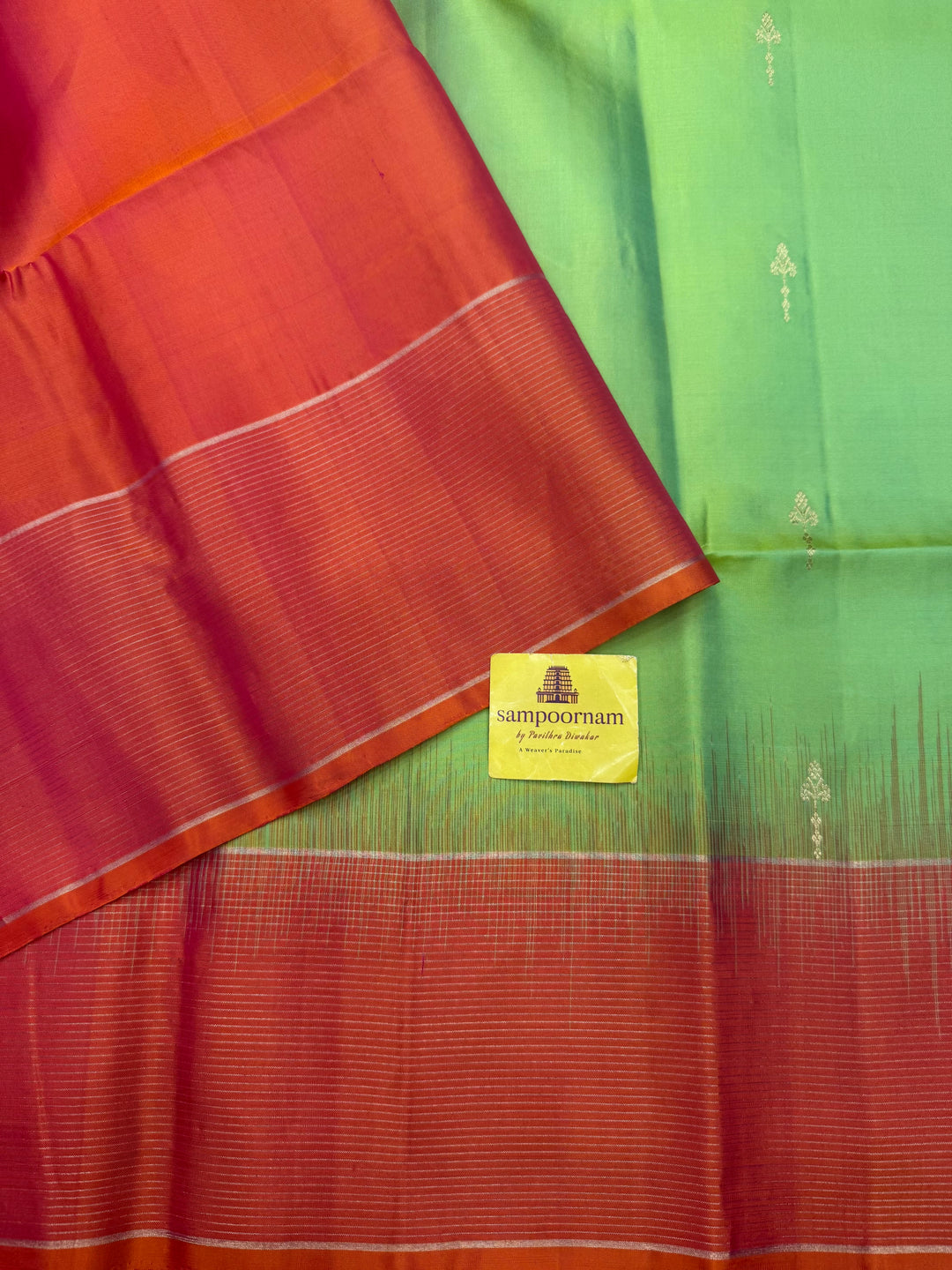 Double Shaded Green with Orangish Pink , Rich Zari Butta in the body and grand Pallu , Pure Soft Silk Saree