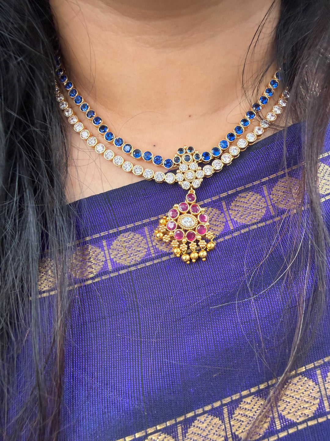Two line elegant blue & white addigai necklaces, paired with a stunning red & white statement pendant and matching ear drops.