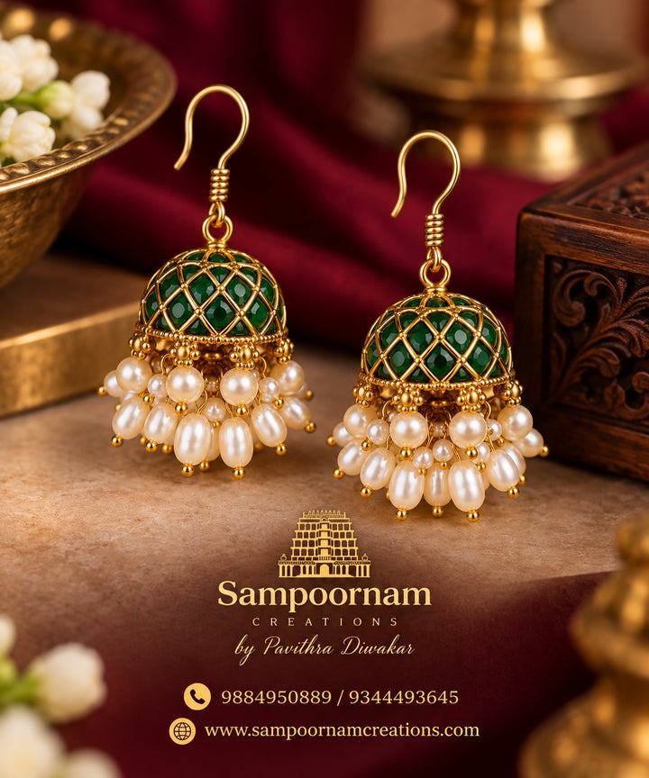 A Classic Green Stone Jhumka featuring an Intricate Gold - Toned Lattice design , Beautifully accented with Casading freshwater - style Pearl Drops