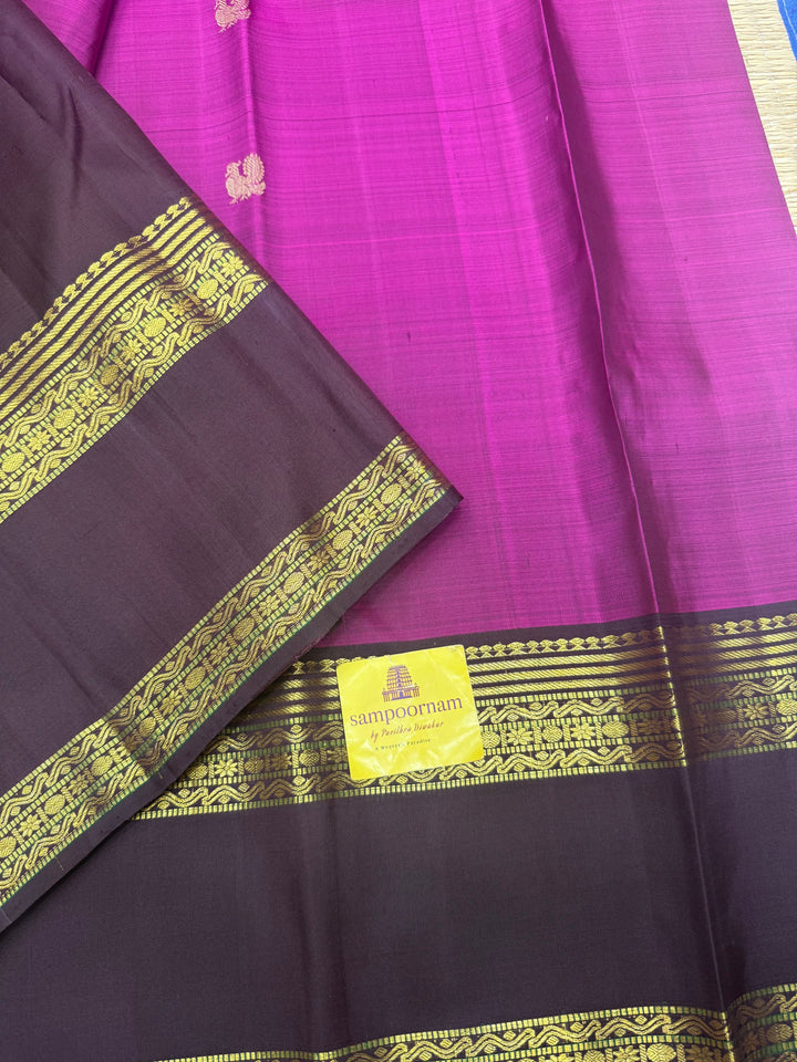 A Vintage Classic Jamun Colour Saree with Dark Brown, Traditional Mayil and Chakram Butta in the Body and Rich Zari Pallu , Pure Kanjivaram Silk Saree