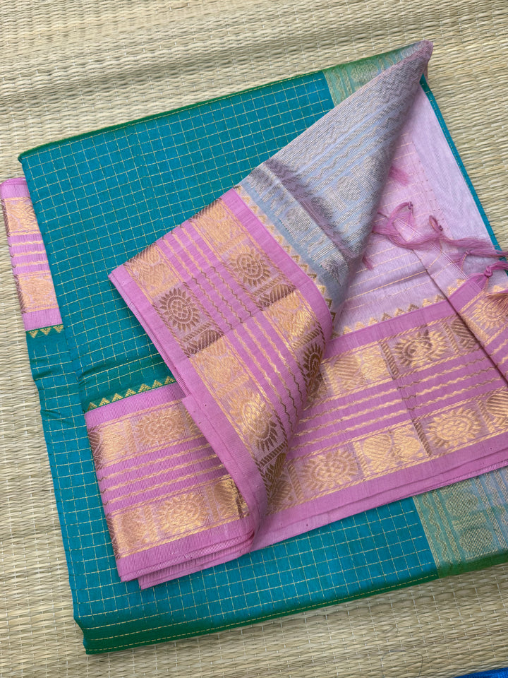 The most loved Double Shaded Sea green with Baby Pink saree, with Zari checks in the body and traditional rettapet border and Pallu Korvai Silk Cotton Saree
