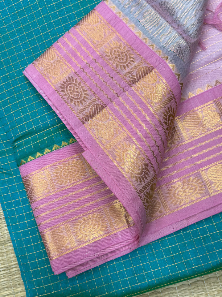 The most loved Double Shaded Sea green with Baby Pink saree, with Zari checks in the body and traditional rettapet border and Pallu Korvai Silk Cotton Saree
