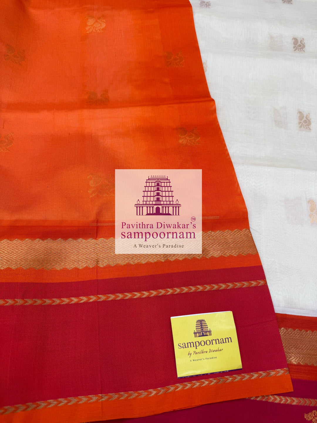 Offwhite with Orange, Rich Zari Butta in the Body, Traditional Borders with Peacock Motifs and Grand Pallu Korvai Silk Cotton Saree