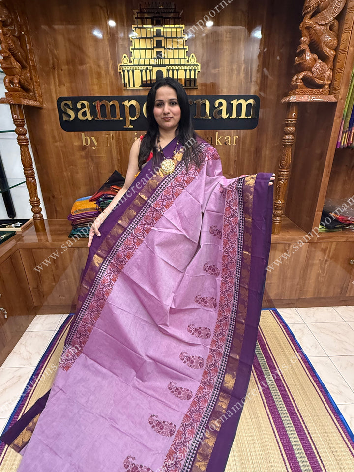 Purple with Dark Purple , Mango Motifs and , Handblock print in the borders and Pallu , Chettinad Cotton Saree