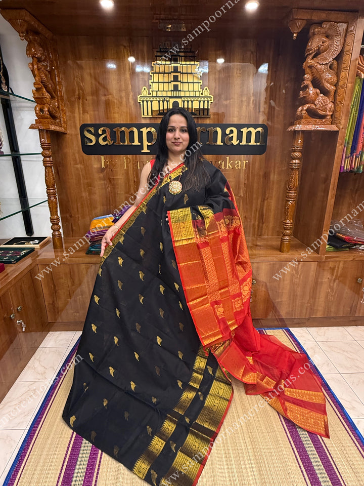 Black with Red , Zari Parrot motif in the body and  One side big rettapet border , grand Pallu Silk Cotton Saree