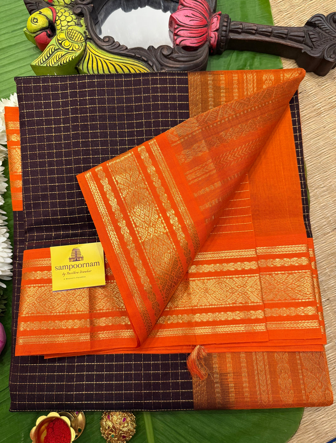 Dark Coffee Brown with Fanta Orange colour ,rich zari checks in the body ,traditional borders  and rich pallu Korvai Silk Cotton Saree