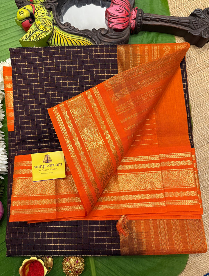 Dark Coffee Brown with Fanta Orange colour ,rich zari checks in the body ,traditional borders  and rich pallu Korvai Silk Cotton Saree