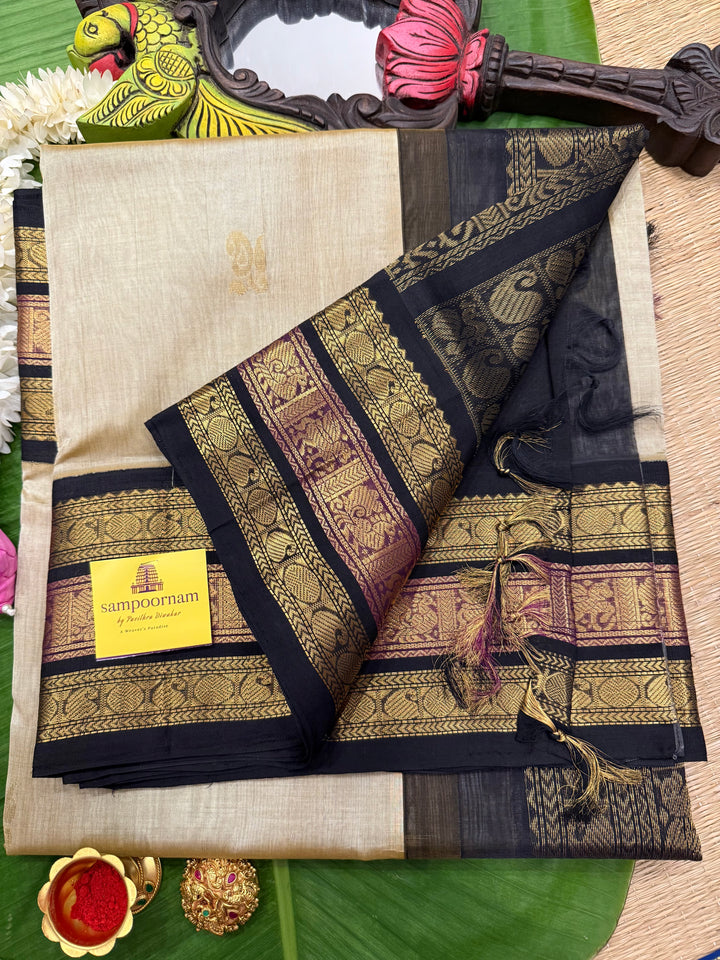 Gold with Black colour Rich Zari Butta in the body , Kanchi border and rich pallu Korvai Silk Cotton Saree